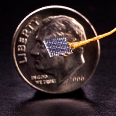 A BrainGate electrode array with a dime for size comparison. Photograph: Matthew McKee/Brown University